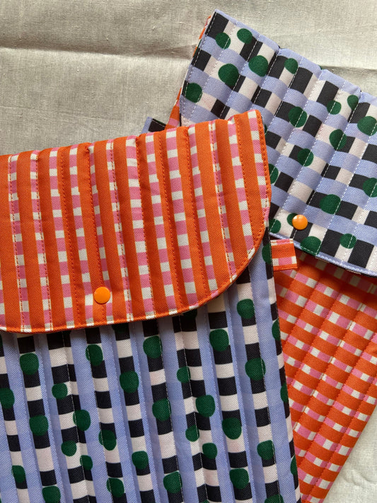 puffy laptop sleeve in bright plaid. fit up to 15.5 inch laptop